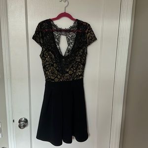 Black and gold metallic lace cocktail dress.